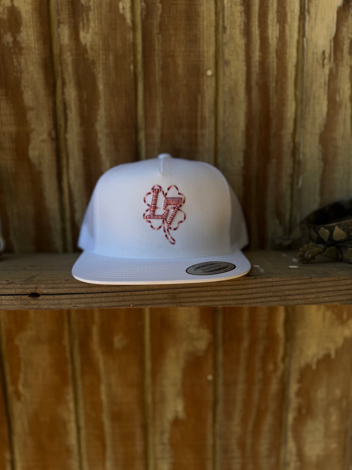L7 Logo white cap pink logo color
