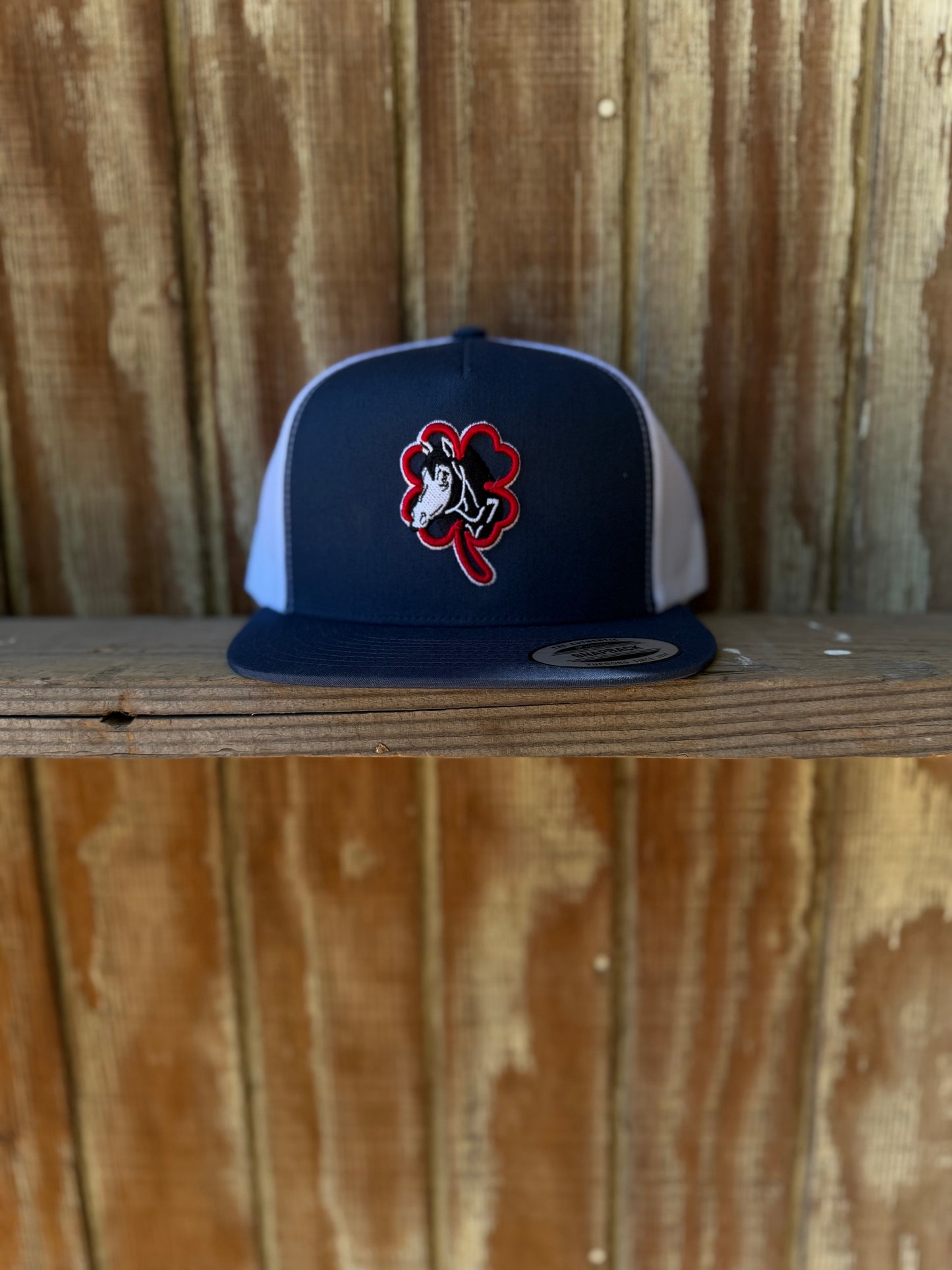 Navy blue hat horse logo red clover white outline