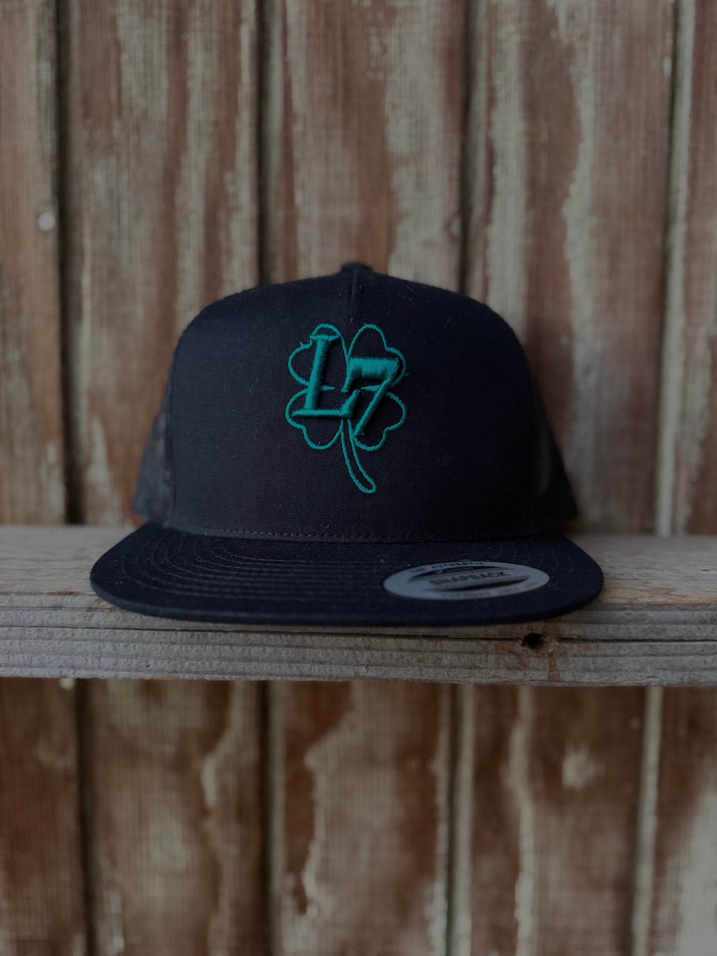 Black hat teal L7 logo